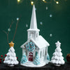 Decorative ceramic church with trees and stars on a dark background